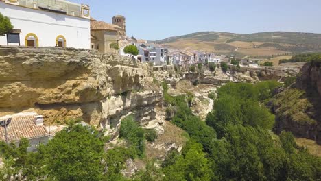 aerial view of the white town of alhama de granada and its famous cliff