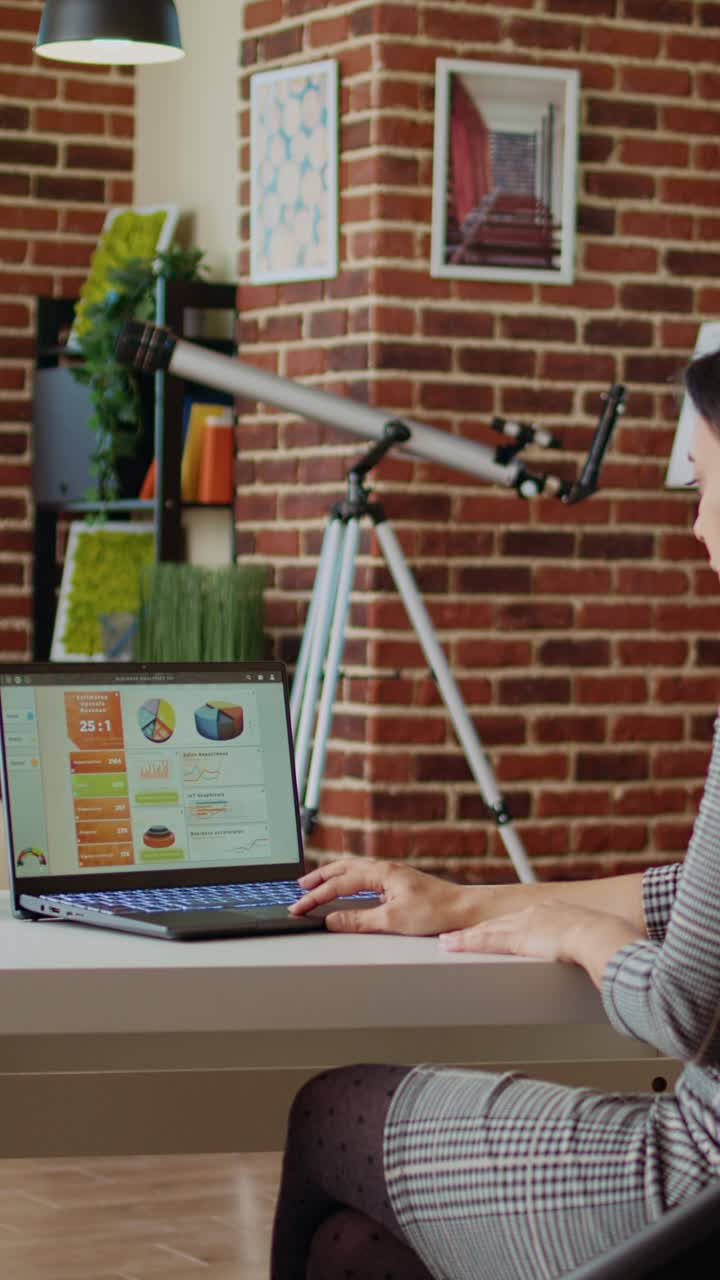 Vertical video Remote employee optimizing market performance charts at home