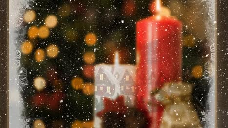 composición de video con nieve sobre la habitación con decoraciones de navidad vistas a través de una ventana helada