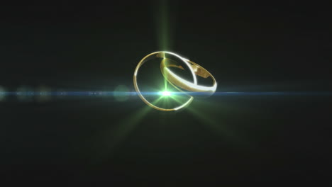 dos anillos dorados girando contra un fondo negro