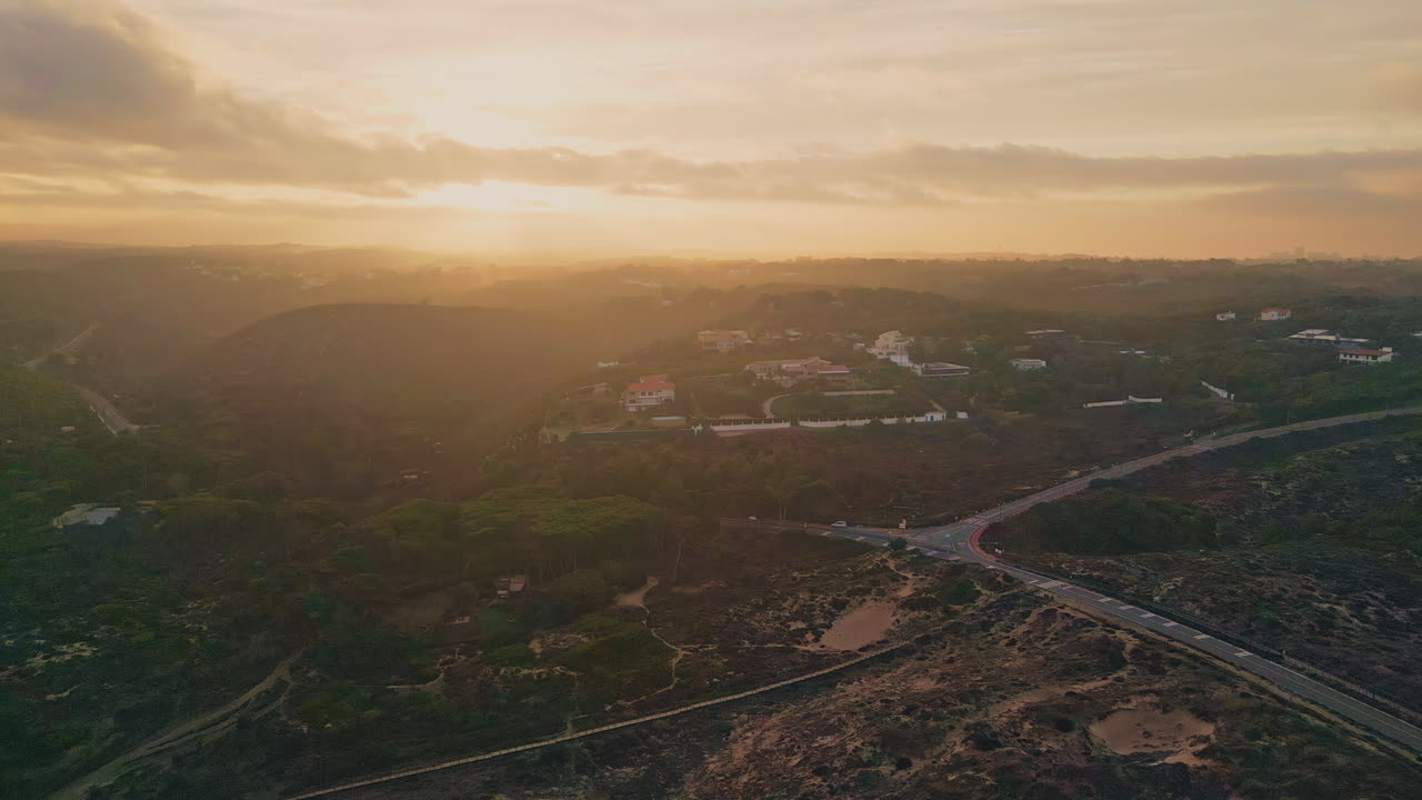 Amazing summer sunrise aerial view. Golden sun rising in morning cloudy sky