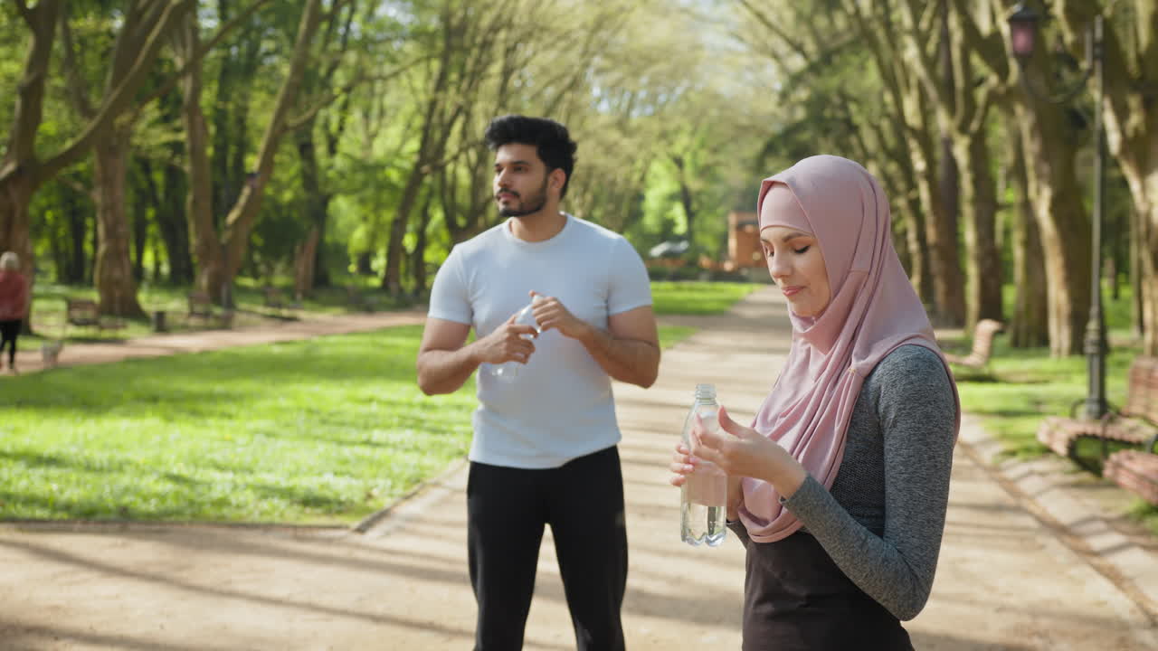 Couple enjoying a relaxing outdoor workout in a park