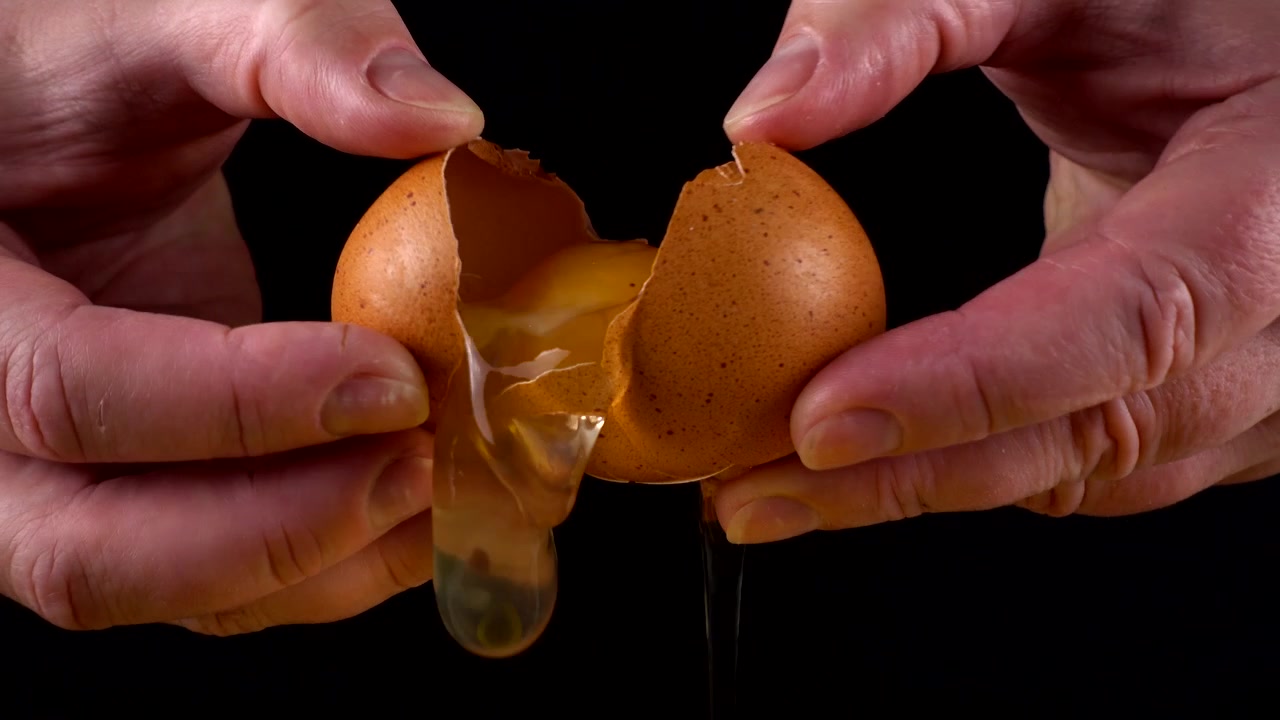The cook reveals a broken raw egg.