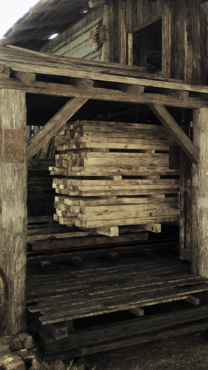 Old wooden warehouse with stacked crates in a rustic western town