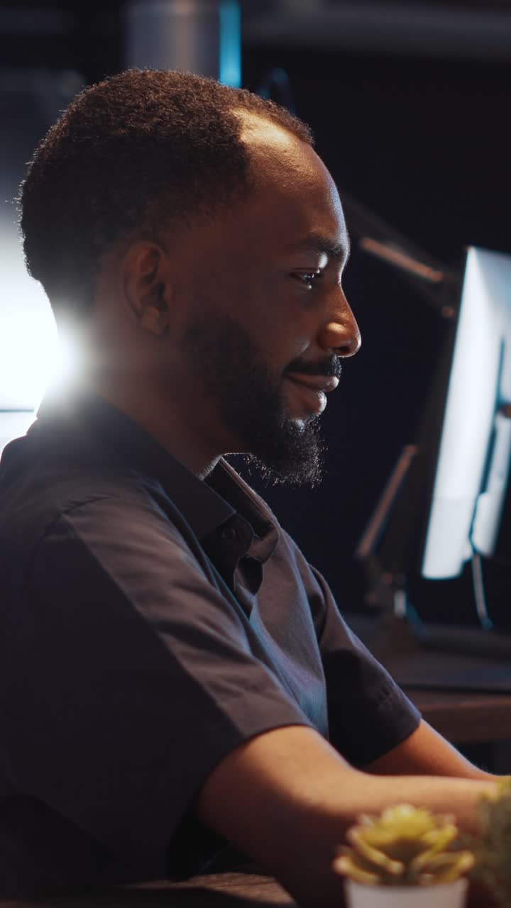 Vertical video: Office worker analyzing executive data report on laptop