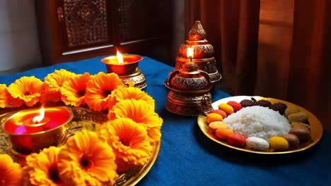 floral arrangement with candles and traditional food