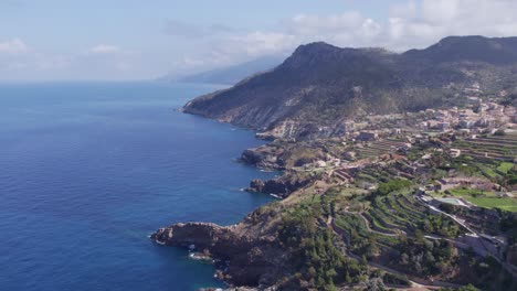 Reveal-shot-of-Banyalbufar-town-at-mallorca-Island-during-day-time,-aerial