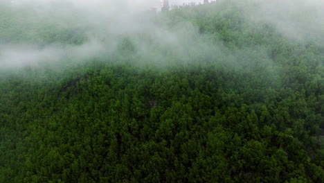 foggy georgian mountains in ushguli - aerial drone shot