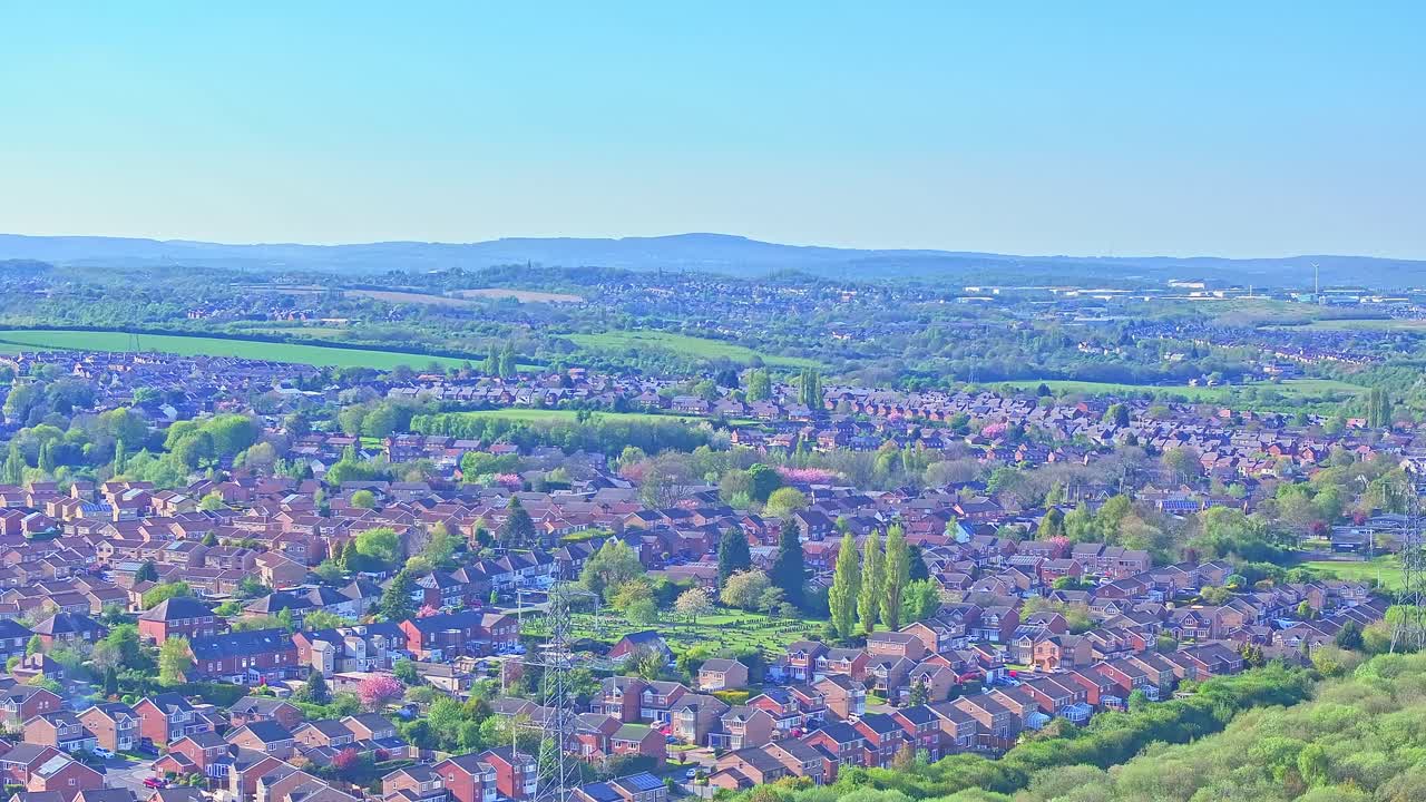 Crane up drone shot of residential area during the day in Rother Valley Country Park in the Metropolitan Borough of Rotherham, South Yorkshire, England