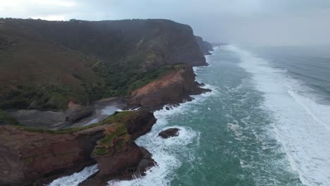 The-Blue-Pool-On-The-Famous-Gap-On-The-Southern-End-of-Piha-Beach-In-New-Zealand