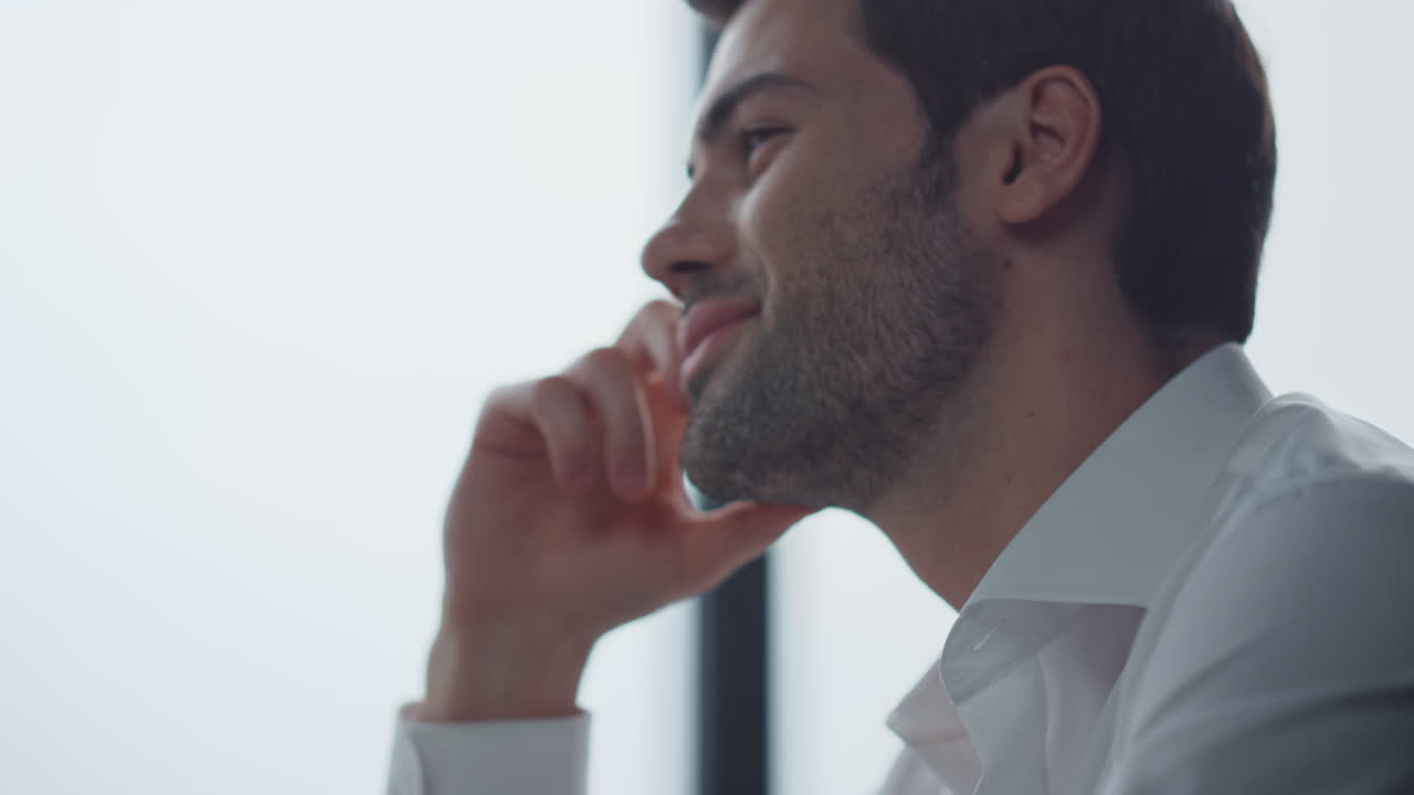 Male manager looking on laptop screen