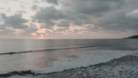 Wide-drone-aerial-shot-of-the-beach-and-mountains-during-sunset-in-4k,-Costa-Rica