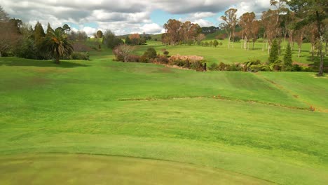 flying over golf course green flag with drone