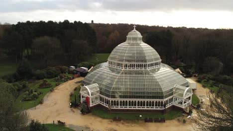 sefton park palm house liverpool victorian exotic conservatory greenhouse aerial botanical landmark dome building rising pull back