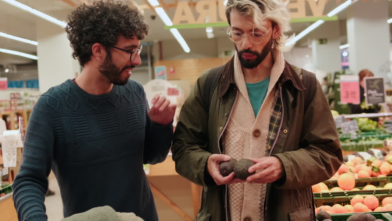 Gay Couple Shopping for Avocados at Grocery Store