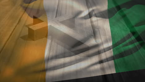 irish flag animation overlaying wooden cross on rustic wooden background