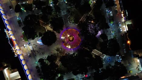 Spiral-shot-of-the-christmas-lights-of-the-kiosk-in-the-park-of-Huajuapan-de-Leon,-Oaxaca,-in-Mexico