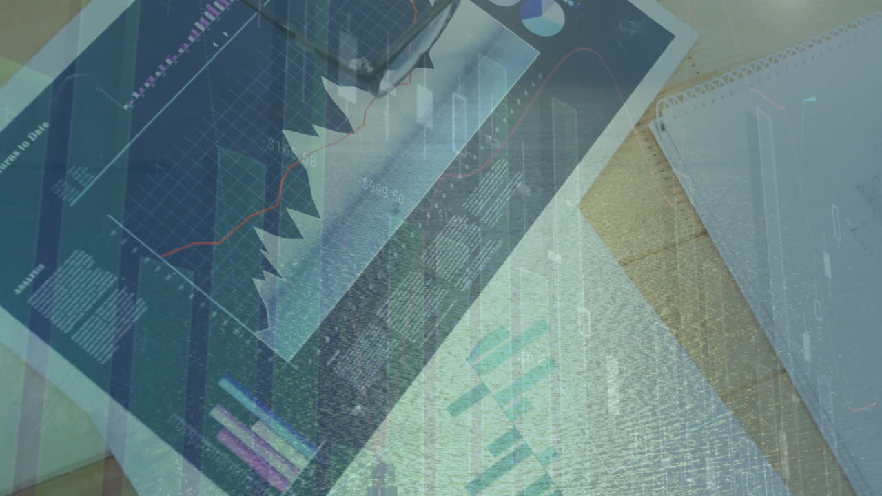 Financial analytics being overlaid on wooden desk, showing notebook, pen, floating charts