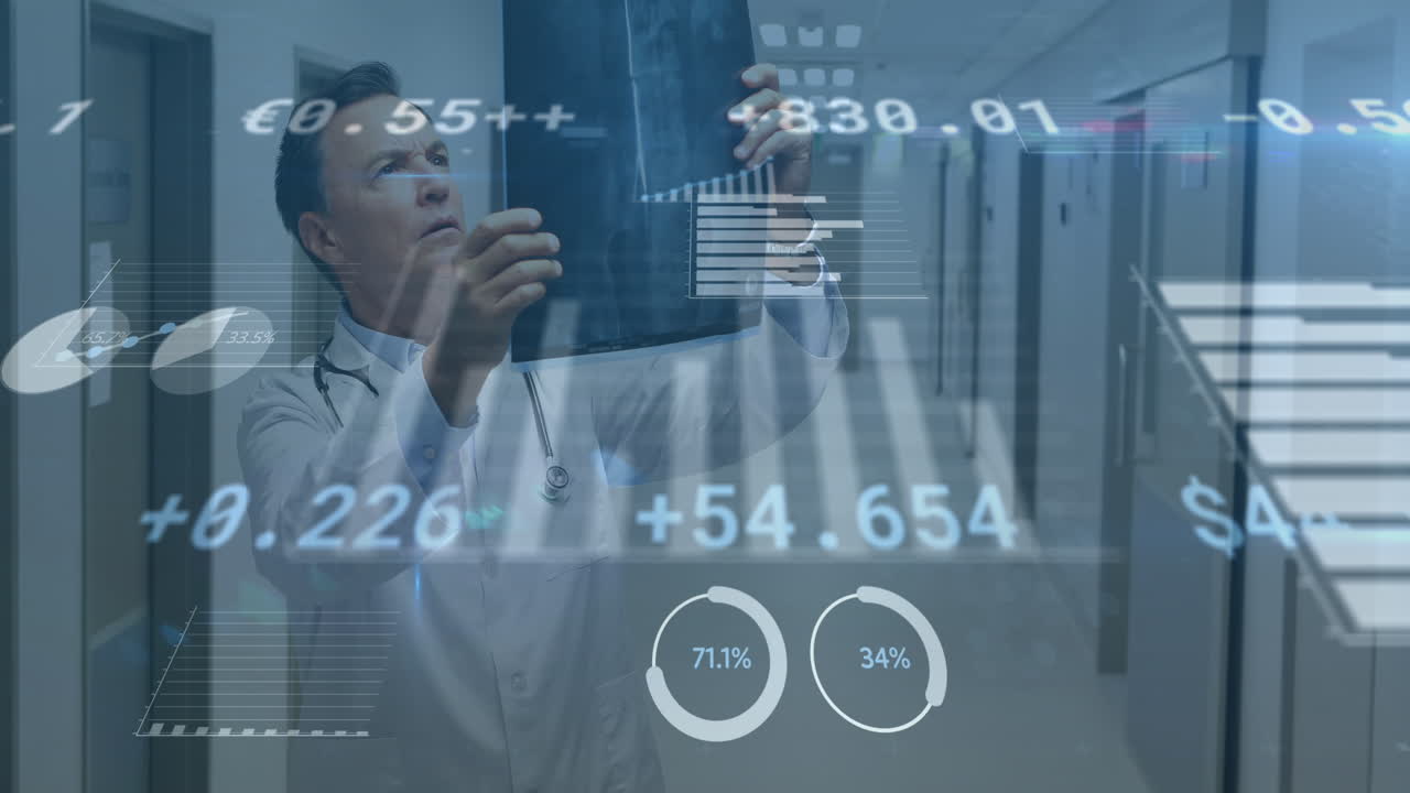 Animation of financial data processing over caucasian male doctor with x ray scan