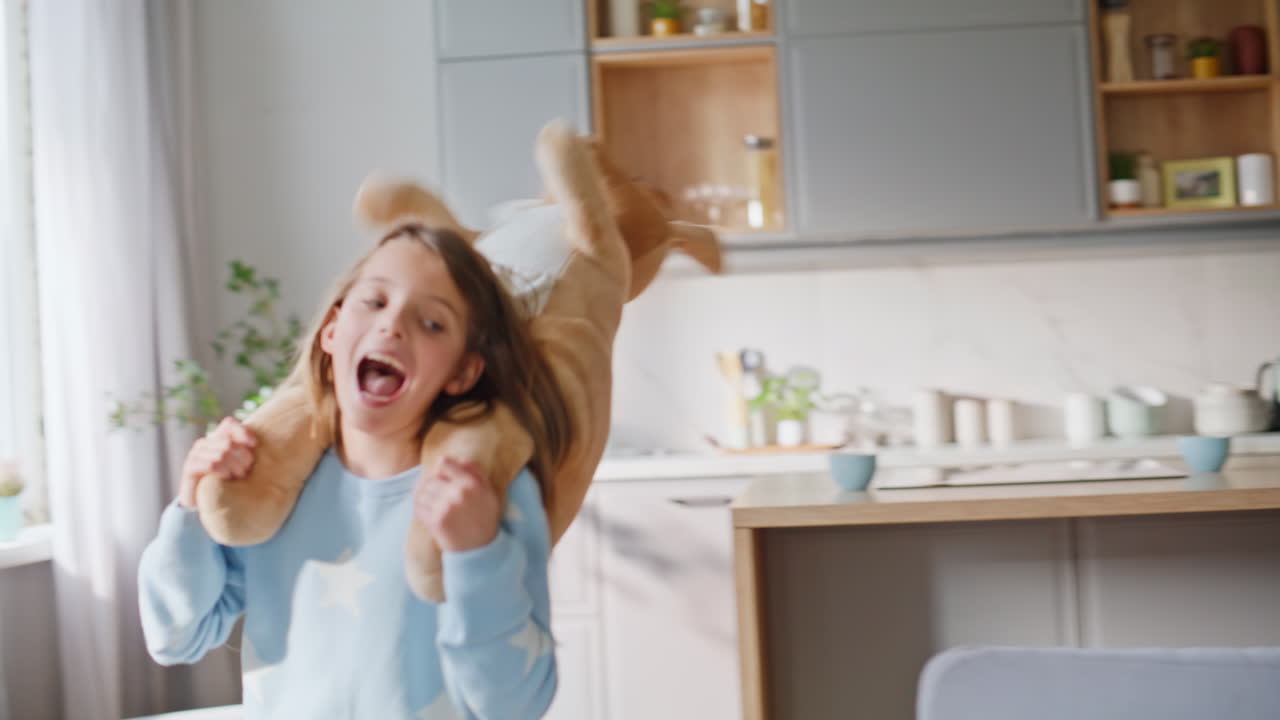 Stressed freelancer distracted daughter running playing toy shouting closeup