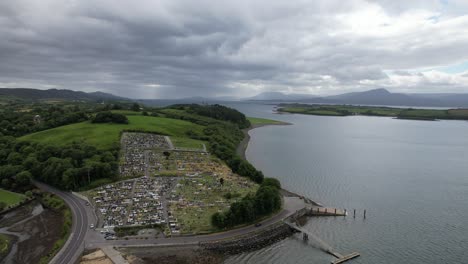 cemetery overlooking sea near bantry west county cork, ireland aerial drone view