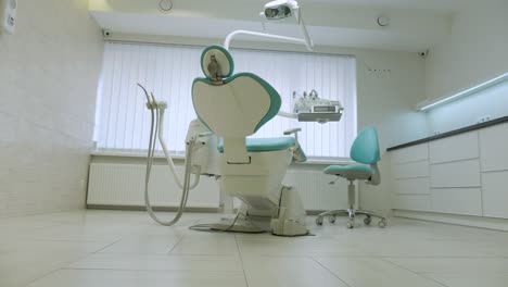 hand turn on lamp in dental clinic interior of dentist office health care and medicine  on white background. bright light at the dental clinic