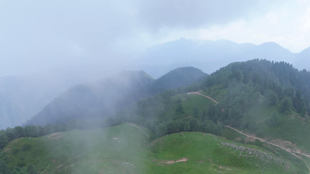 Epic Drone Shot of Mushkpuri Peak | Clouds Floating Over Green Hills