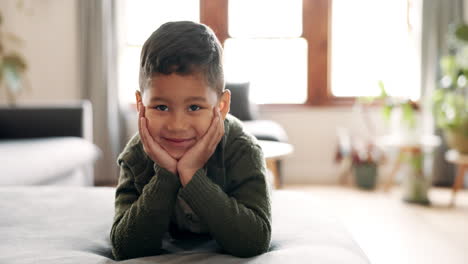 Happy,-hands-on-face-and-kid-relax-on-the-sofa