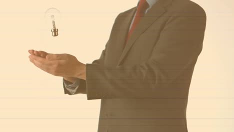 animation of businessman throwing and catching lightbulb, on pale orange background