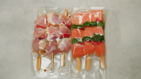 preparing assorted meat skewers for grilling