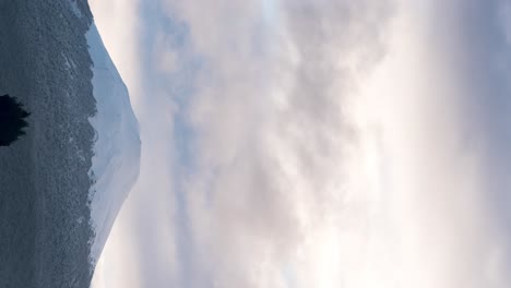 vertical view of the hornopiren volcano with its snowcapped summit on a cloudy morning, hualaihue, southern chile