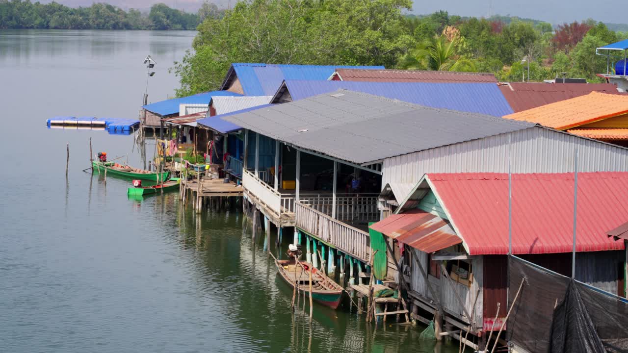 Cambodian traditional riverside stilted wooden houses with forest in Cambodia, outdoor