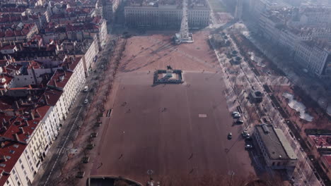 People-At-Place-Bellecour-In-Lyon,-France---Massive-Public-Square-With-Equestrian-Statue-And-Ferris-Wheel