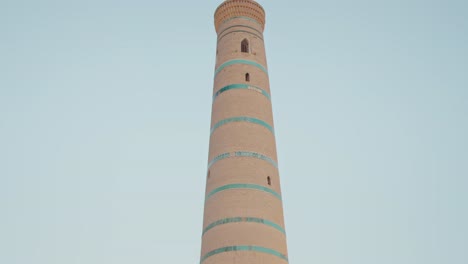 tall brick minaret in uzbekistan