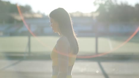 woman jogging on outdoor track in sportswear at athletic field