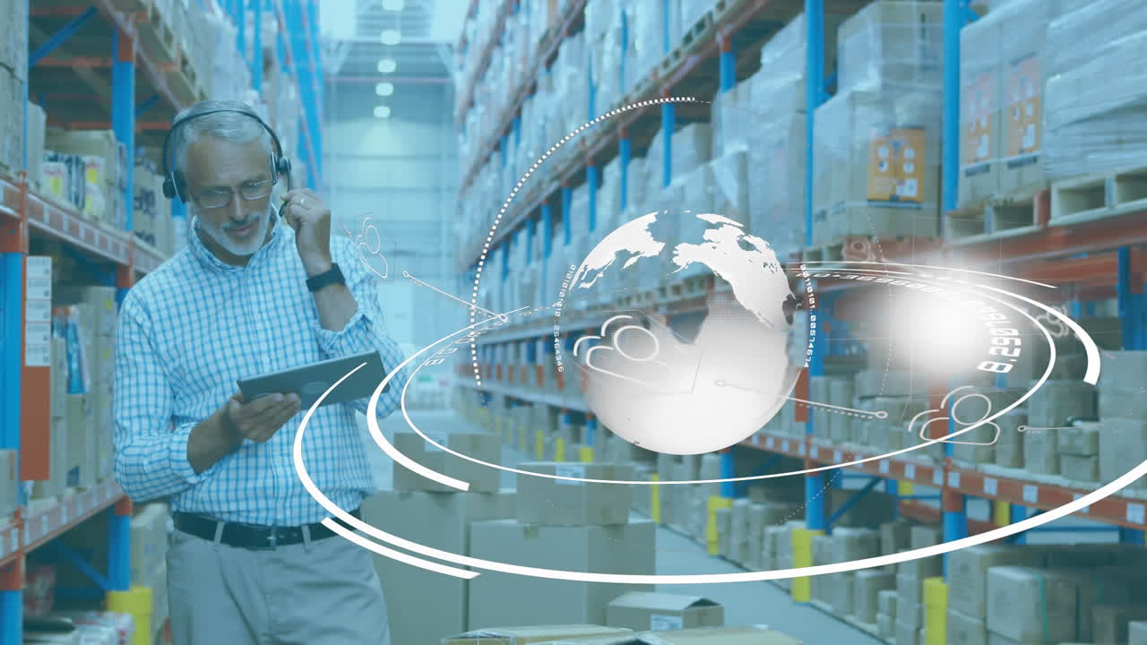 Animation of Caucasian man working in warehouse wearing headset over globe spinning