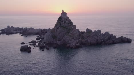 Reveal-shot-of-Nedjelja-Church-at-Montenegro-during-sunset-light,-aerial