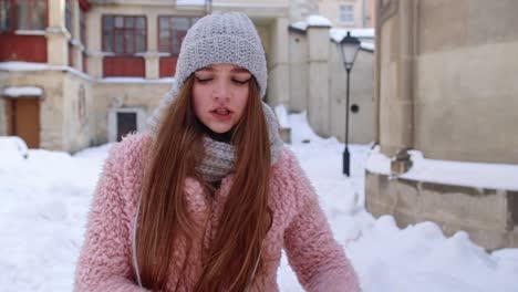 Woman-tourist-showing-negative-emotions,-hate,-rage,-upset,-stress-while-standing-outdoor-in-winter