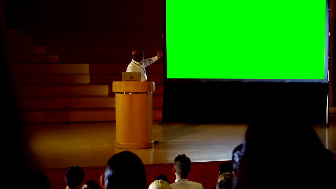 Mature African american businessman giving presentation in a business seminar 4k