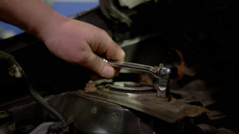 a mechanic at a car service station checking the car
