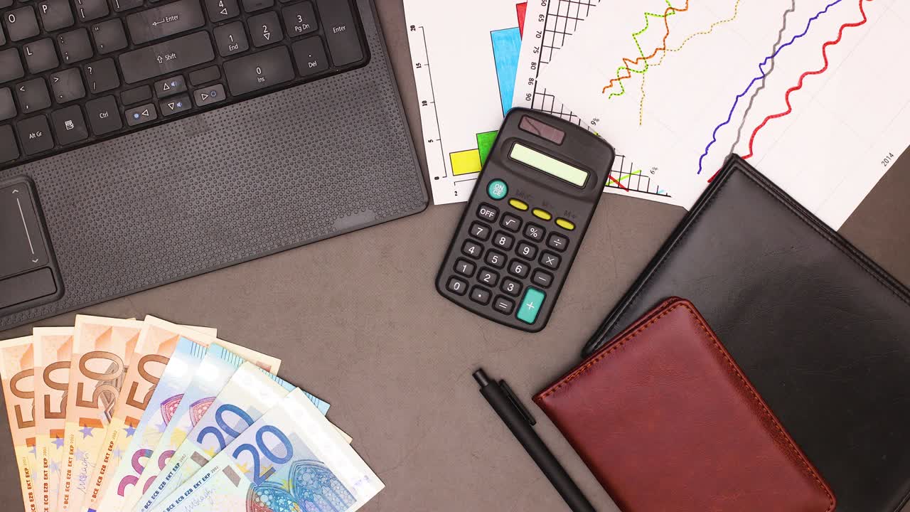 Euro banknotes appear on left corner of business work space office desk - Stop motion