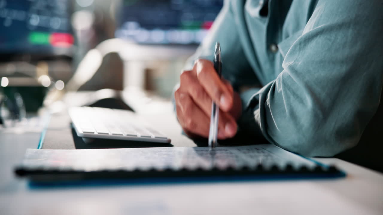 Businessperson analyzing data at desk