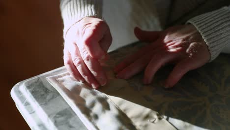 Close-Up-Of-Woman-Using-Needles-On-Curtain-Fabric-In-Slow-Motion