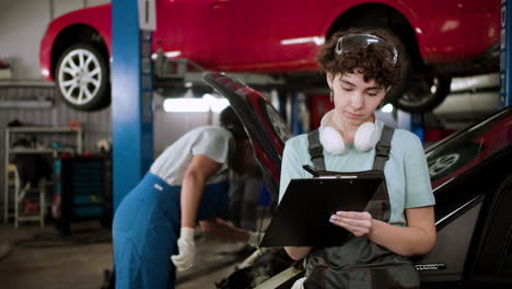 women working on a vehicle