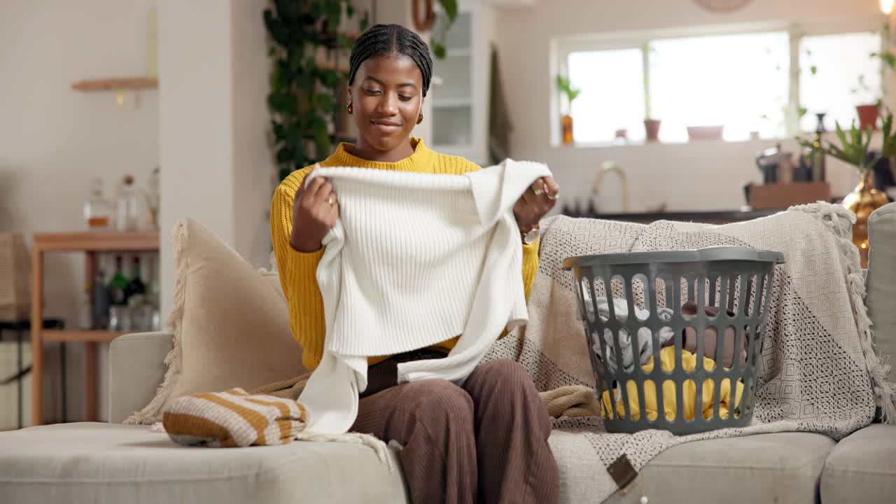 Woman Folding Laundry at Home