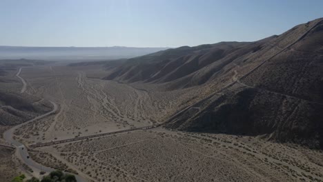 Aerial-view-of-the-California-aqueduct-pipeline-and-mountain-range