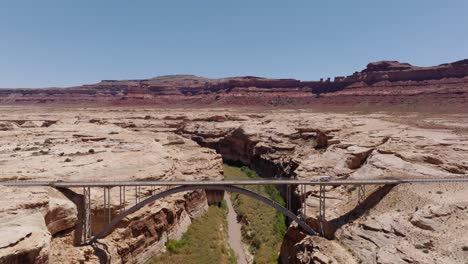 Car-pulling-the-Trailer-over-the-Hite-Crossing-Bridge-in-Hite,-Utah-State-Route-95-over-the-Colorado-River