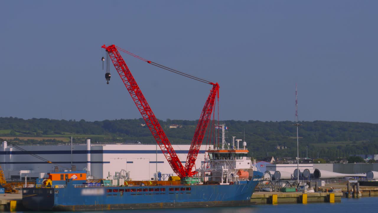 Red Crane on Cargo Ship in Port