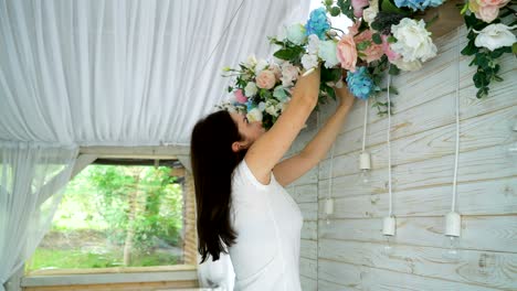 beautiful florist creating spring colorful bouquet arrangement