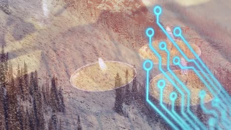 animation of integrated circuit and tealights over mountain landscape